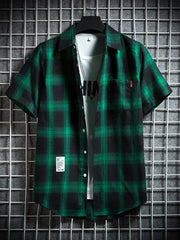 Green plaid short-sleeve cotton button-down shirt with chest pocket.