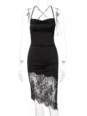 Black satin cowl neck dress with lace trim detail and crisscross straps.
