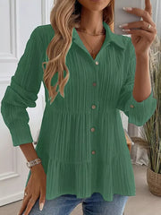 Green textured tiered button-down shirt with crinkled fabric and button details.
