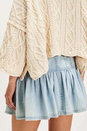 Light blue denim ruffle mini skirt with a cinched waist and tiered hem.
