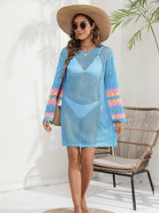 Light blue crochet cover-up dress with striped sleeves and scalloped hem.