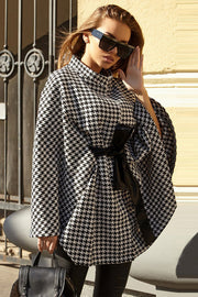 Houndstooth cape trench coat with black bow belt and high neck