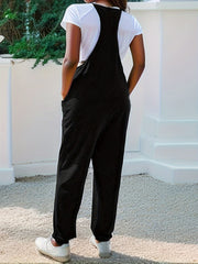 Black heathered loose fit jumpsuit with spaghetti straps and pockets.