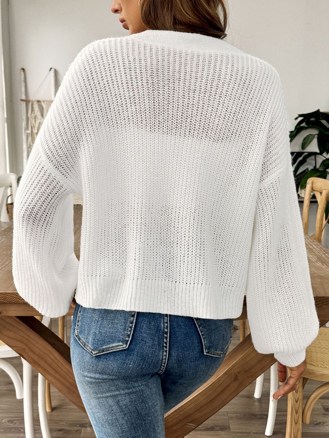 White balloon sleeve button-down knit cardigan with a relaxed fit.