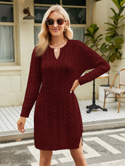 Wine cable knit sweater dress with keyhole neckline and side slits.