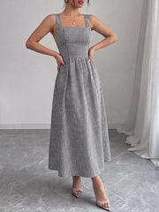 Black and white gingham midi dress with square neckline and a-line skirt.
