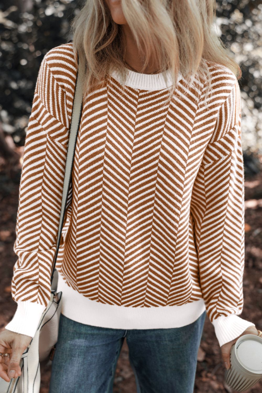 Chevron knit crewneck sweater in camel and white with white trim and cuffs.