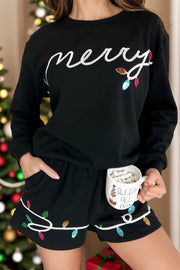 Black loungewear set with sequin Christmas lights and "merry" text.
