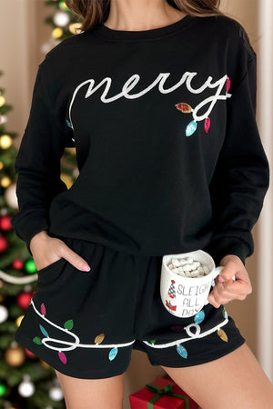 Black loungewear set with sequin Christmas lights and "merry" text.