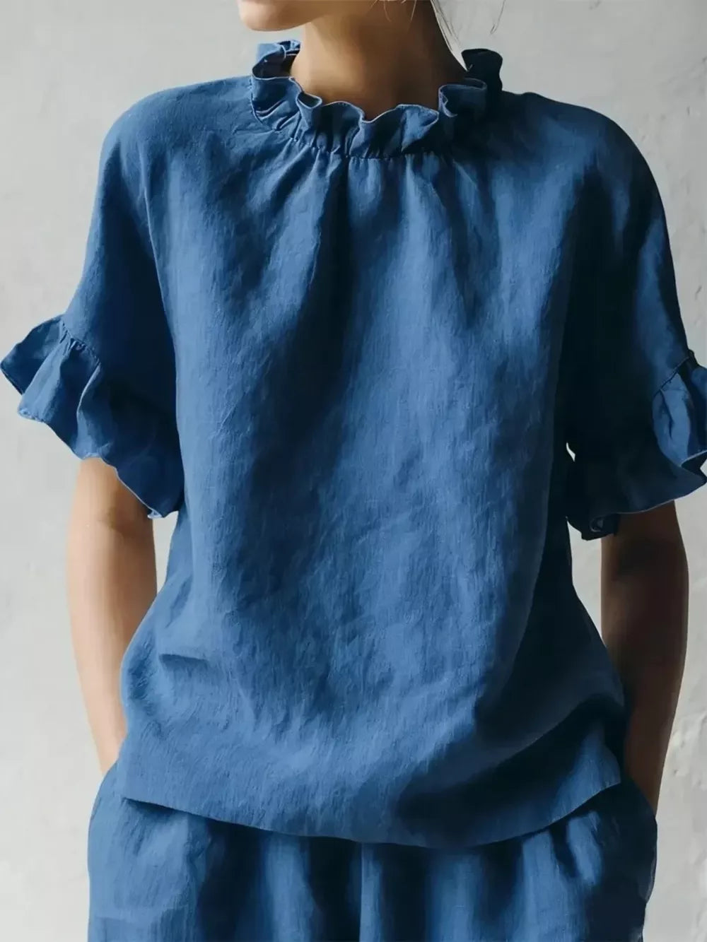 Dark blue half-sleeve shirt with ruffled neckline and cuffs