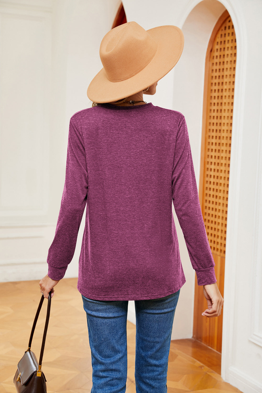 Henley-inspired long sleeve top in heathered red-violet with a crew neck.