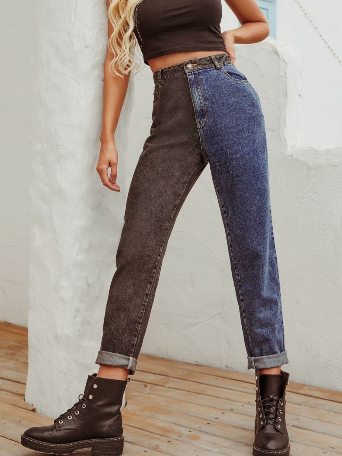 Split-tone straight leg jeans in medium wash and dark wash denim, cuffed hems