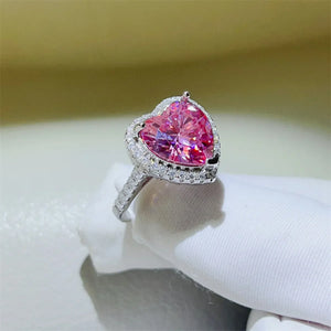 Radiant Heart Moissanite Halo Ring in Fuchsia Pink with a diamond-accented band.