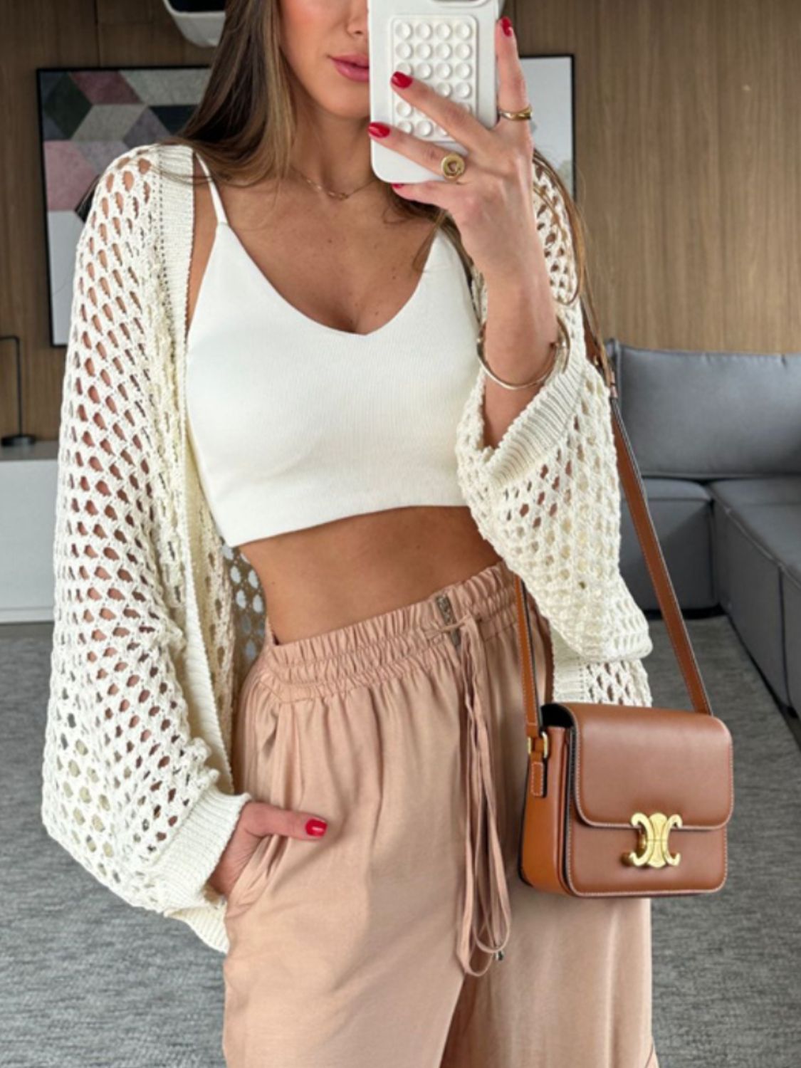 Cream open-knit crochet cardigan shrug with wide sleeves and a relaxed fit.