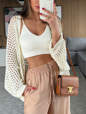 Cream open-knit crochet cardigan shrug with wide sleeves and a relaxed fit.