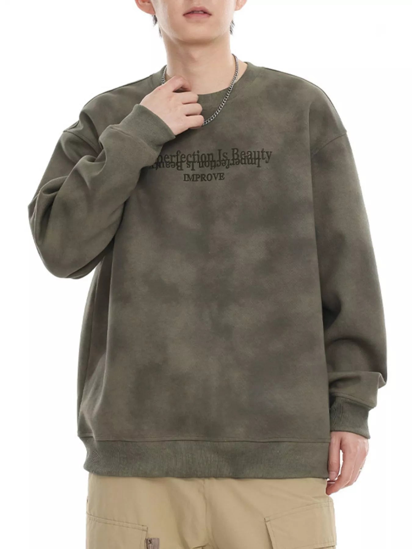 Oversized Army Green tie-dye sweatshirt with "Perfection Is Beauty IMPROVE" graphic.