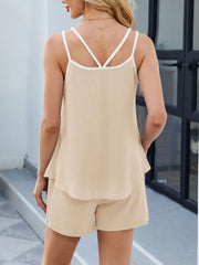 Tan ribbed lounge set with white contrast trim cami and shorts.
