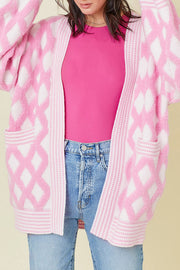 Diamond jacquard knit open cardigan in blush pink with two front pockets.