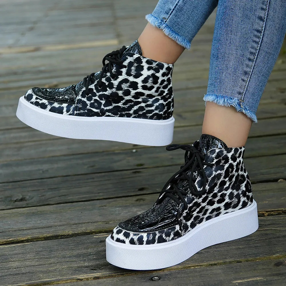 Patent leopard platform high-tops with black patent accents and white soles.