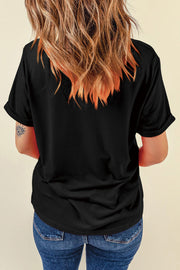 Black t-shirt with rolled sleeves and an embroidered American flag detail on the back.