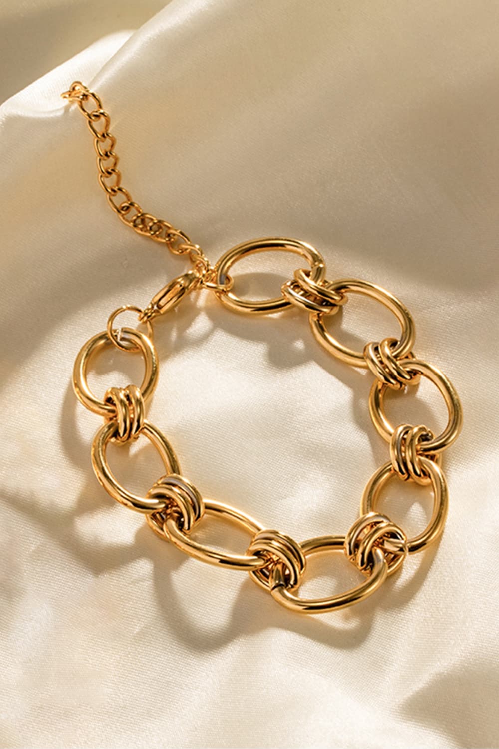 Chunky gold knot link bracelet with adjustable chain