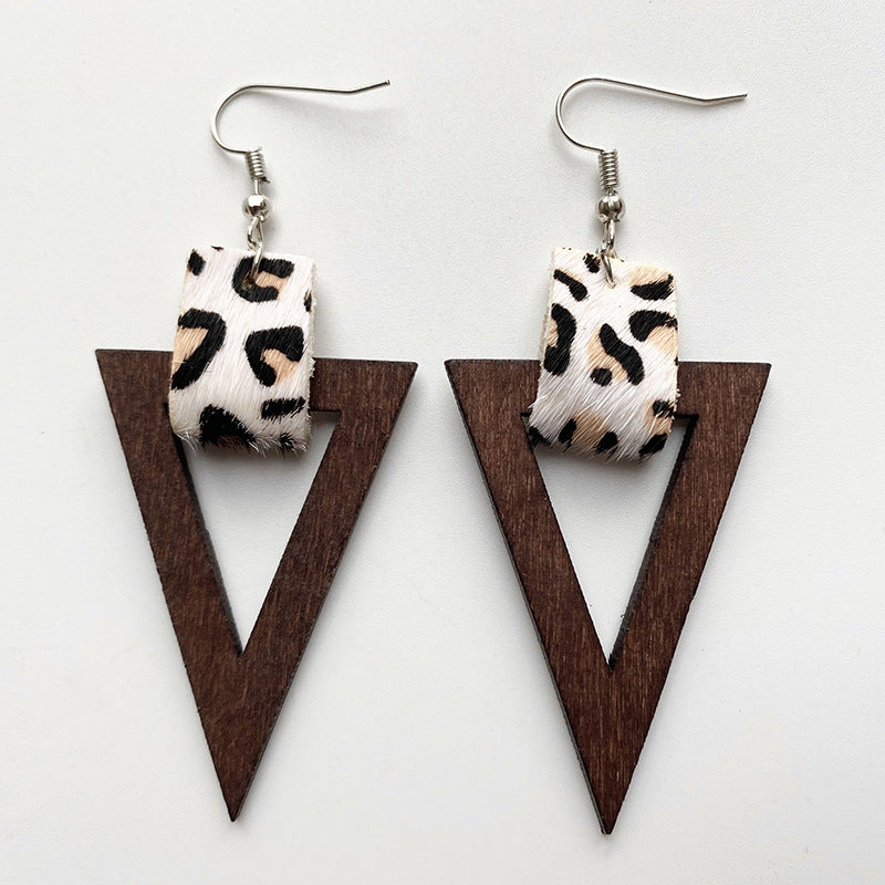 Leopard print and wood triangle earrings with silver hooks.