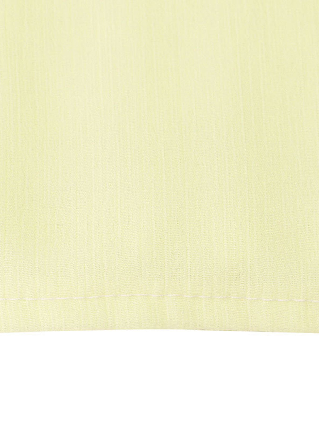 Light yellow airy cami and maxi skirt set fabric detail with visible stitching.