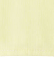 Light yellow airy cami and maxi skirt set fabric detail with visible stitching.