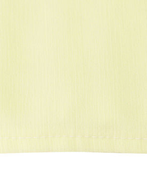 Light yellow airy cami and maxi skirt set fabric detail with visible stitching.