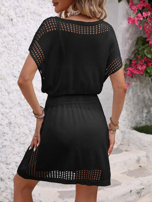 Black mesh V-neck sleeveless dress with a cinched waist and open knit details.