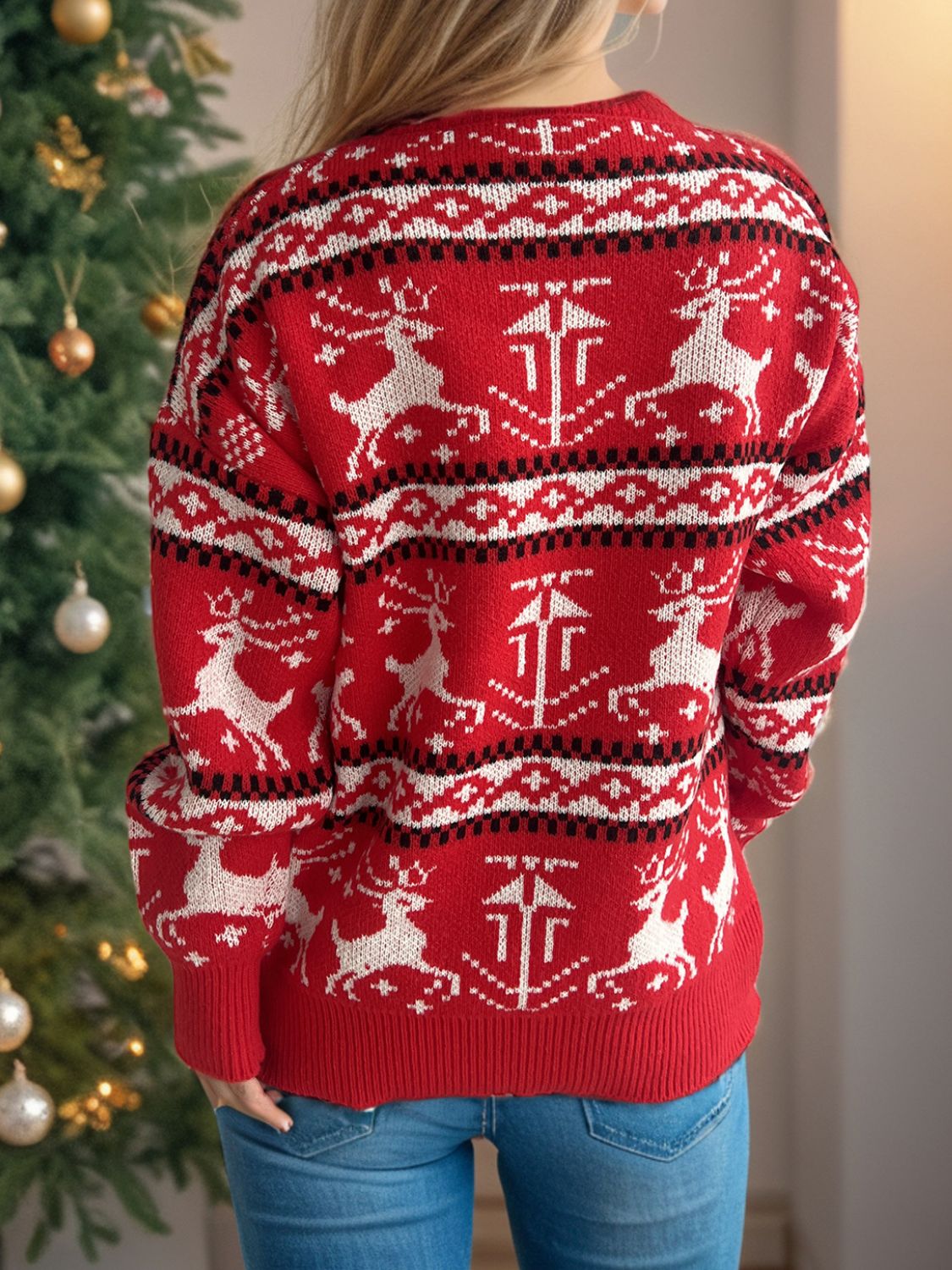 Red crew neck sweater with reindeer and geometric Fair Isle pattern, acrylic knit.