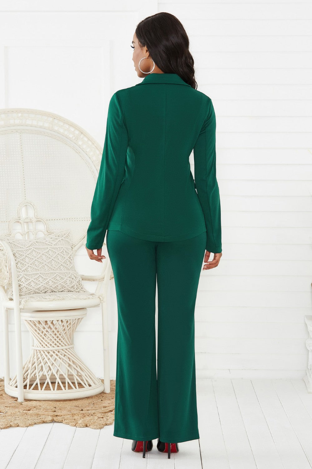 Emerald green flare leg pant suit with a classic blazer and wide leg pants.
