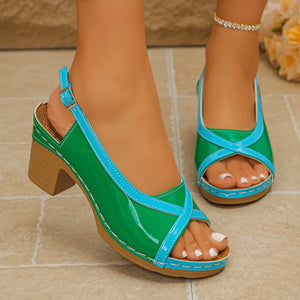 Green and blue open-toe block heel sandals with adjustable ankle strap.