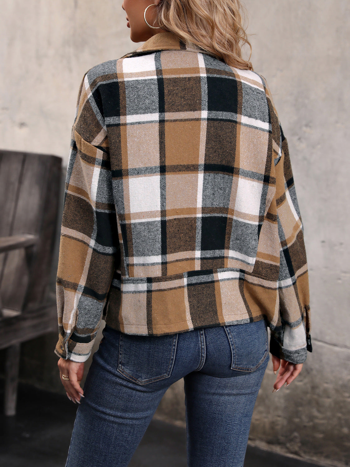 Checked plaid cropped moto jacket in camel with a collared neckline and button cuffs.