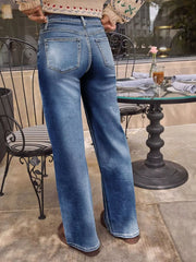 Light blue denim high-waisted wide-leg jeans with button fly and whiskering detail.