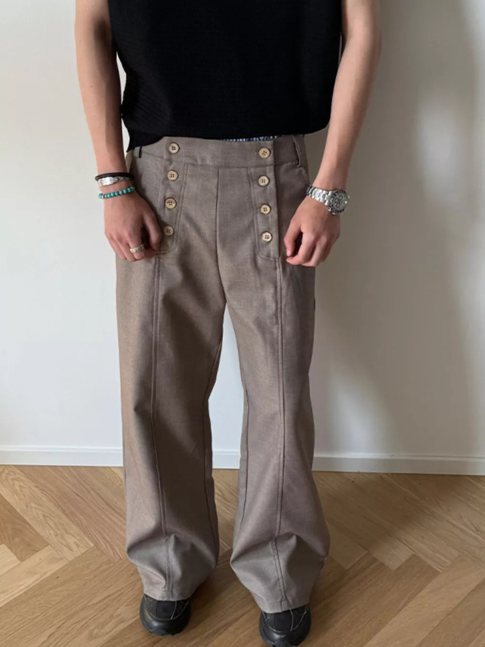 High-waisted wide leg pants in mocha with button detail and front seams.