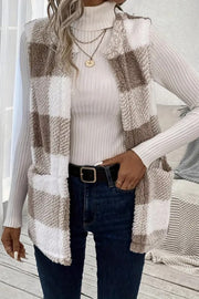 Oversized sherpa gilet in tan and white buffalo check with pockets.