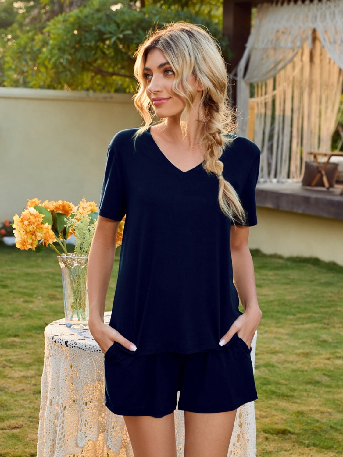 Dark blue V-neck lounge set with shorts and short sleeves.