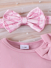 Pink ribbed cotton baby bodysuit with bow detail and matching bowknot headband.