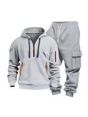 Light gray men's half-zip hoodie and cargo sweatpants set with orange zipper accents.