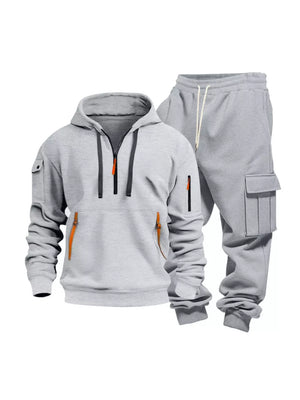 Light gray men's half-zip hoodie and cargo sweatpants set with orange zipper accents.