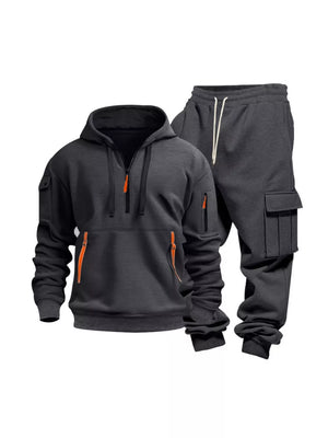 Dark gray men's half-zip hoodie and cargo sweatpants set with orange zipper accents.