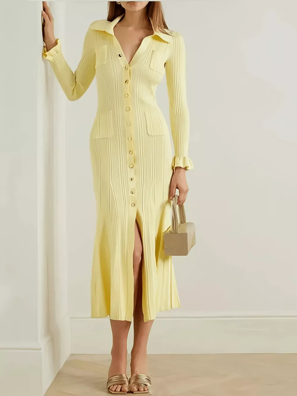 Yellow knit polo collar sweater dress with button front, pockets, and ruffled cuffs.