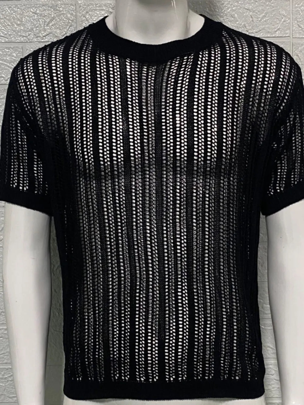 Black open-knit boxy crew neck sweater with short sleeves and vertical stripe pattern.