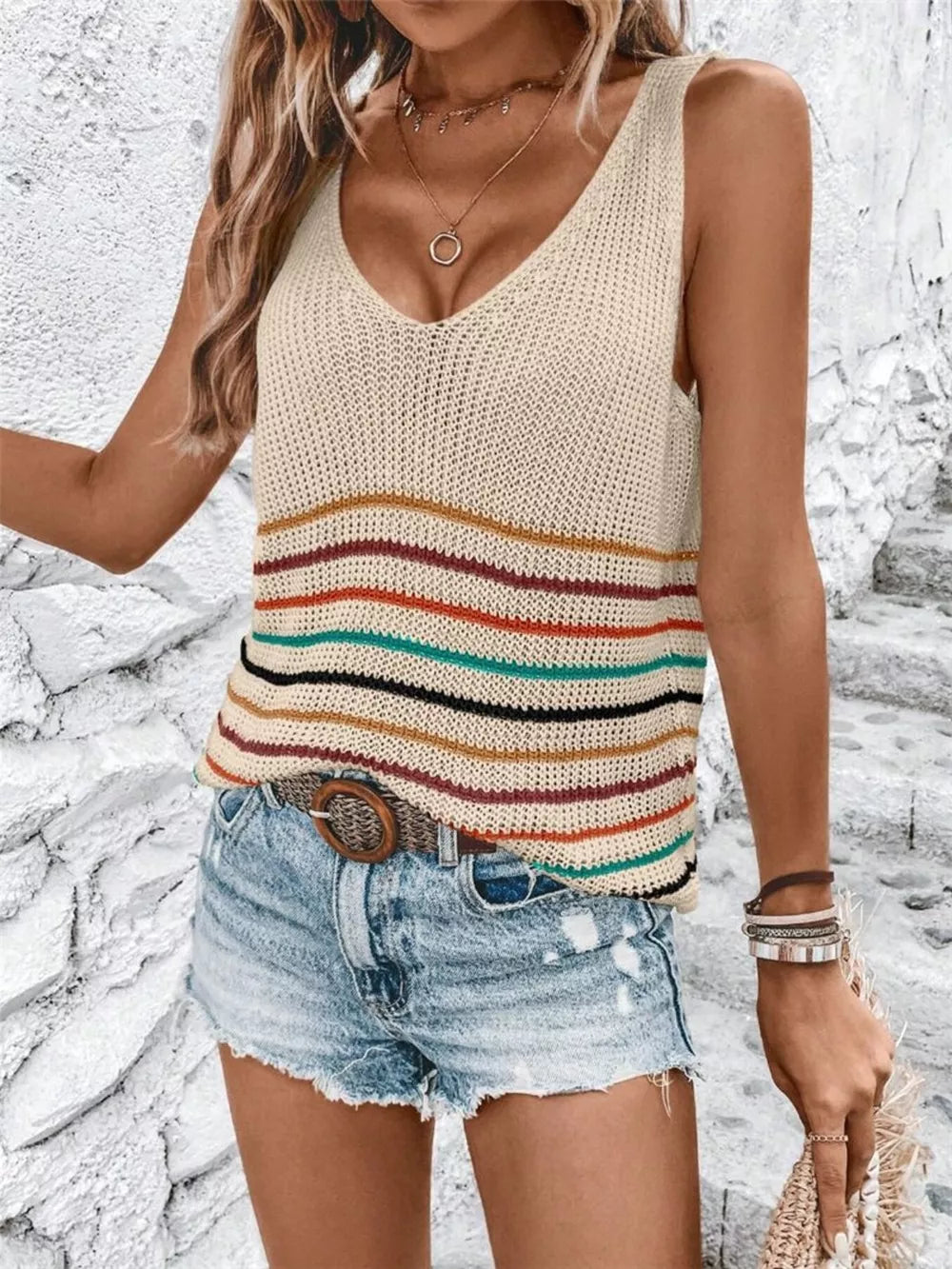 Chic striped knit vest with V-neck and colorful horizontal stripes.