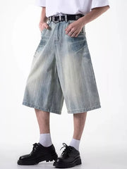 Relaxed fit light blue denim shorts with coin pocket and distressed details.