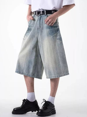 Relaxed fit light blue denim shorts with coin pocket and distressed details.