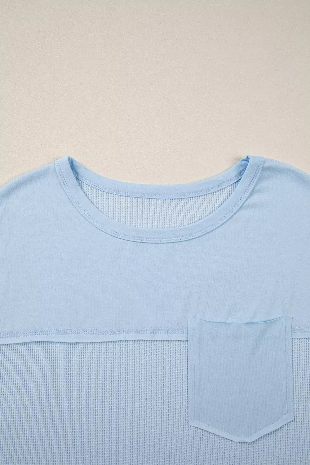 Light blue waffle knit t-shirt with crew neck and chest pocket