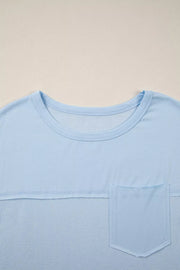Light blue waffle knit t-shirt with crew neck and chest pocket