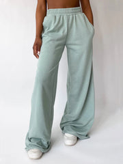 Light green wide-leg lounge pants with elastic waistband and pockets